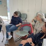 Group of female professionals participating in a workshop session.